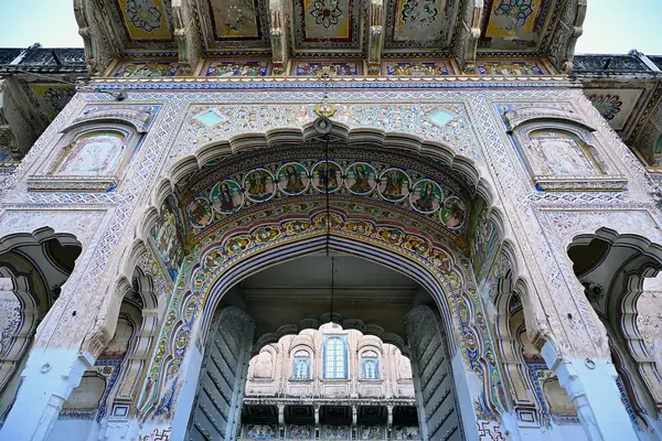 Ornate frescoed entrance arch of an old haveli